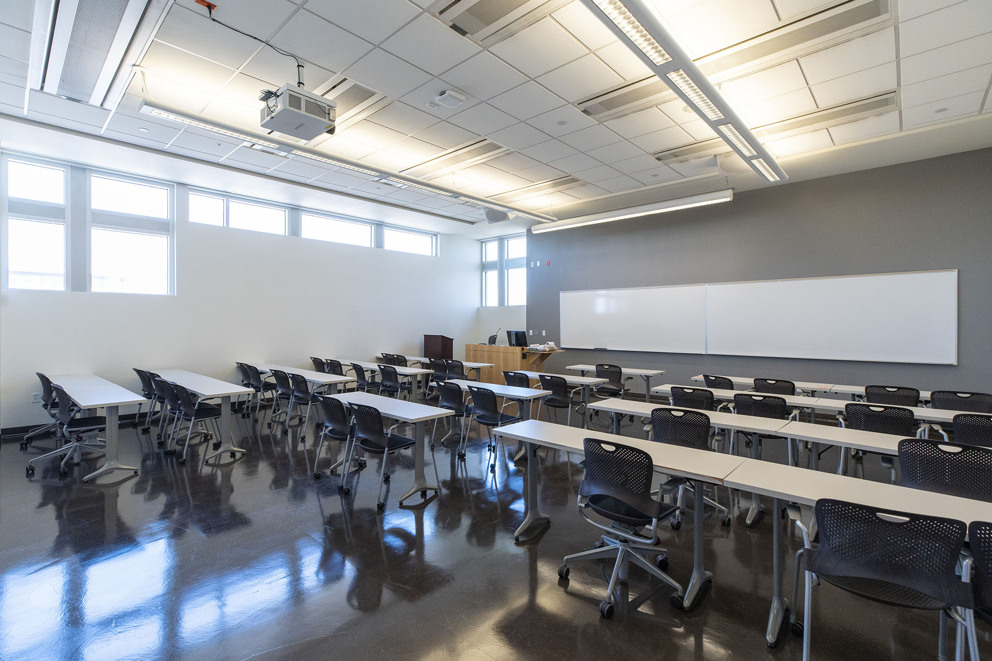 rear view of a UNLV classroom with long whoteboard.
