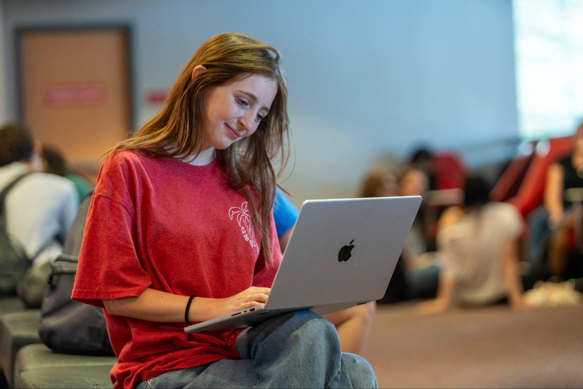 Student working on laptop.