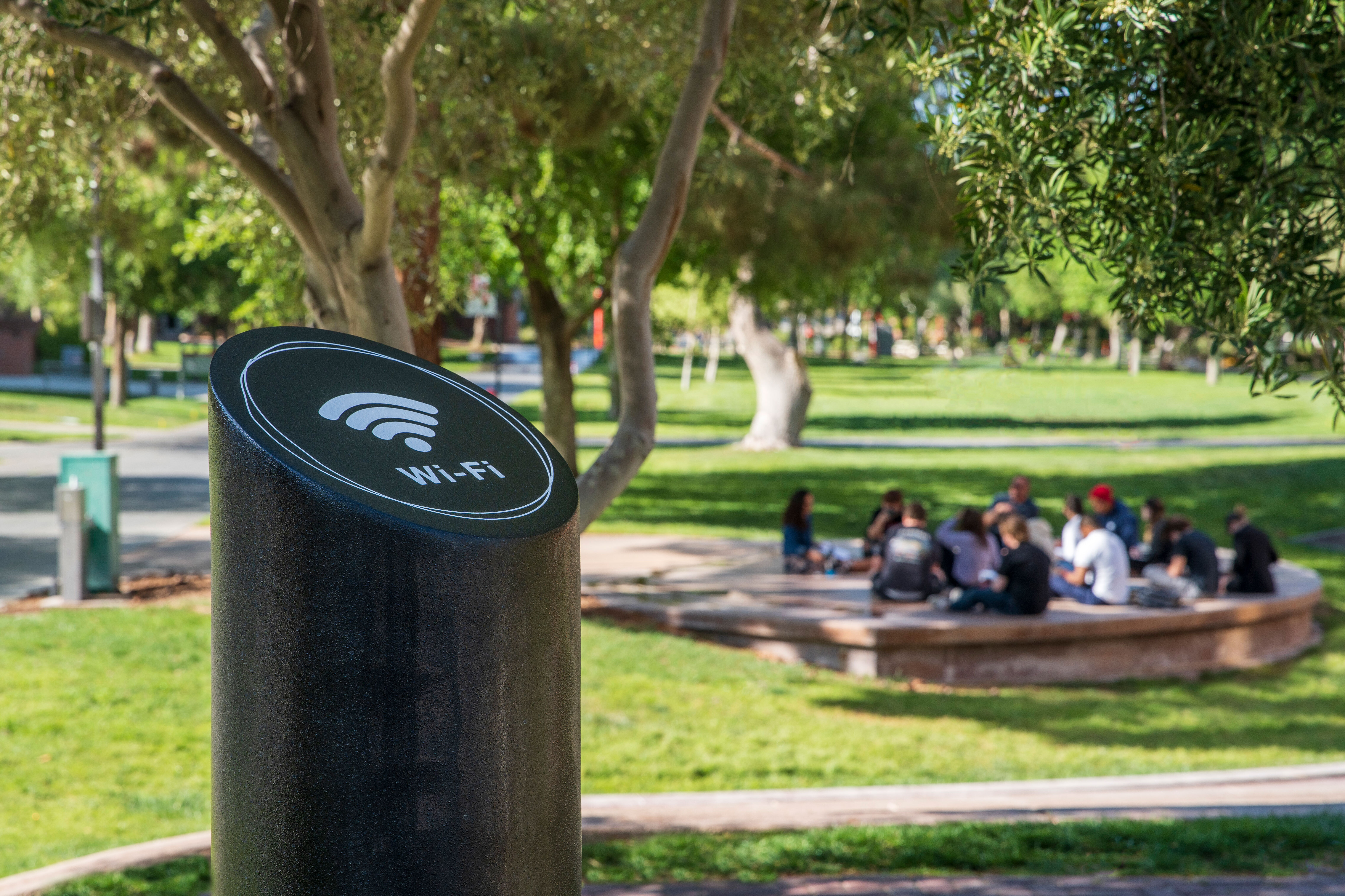 WiFi bollard with a group of people in background