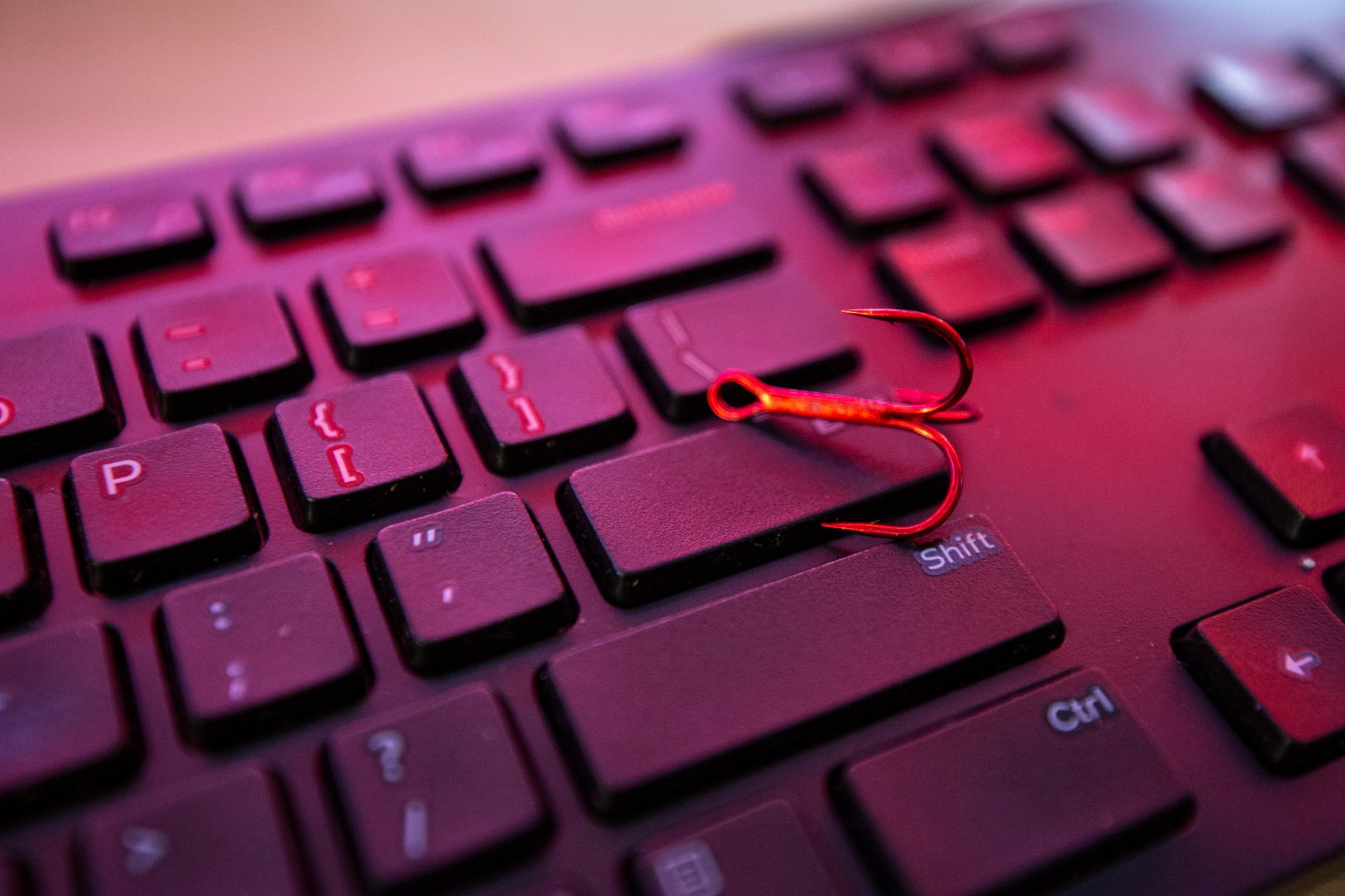 Phishing pin on keyboard.