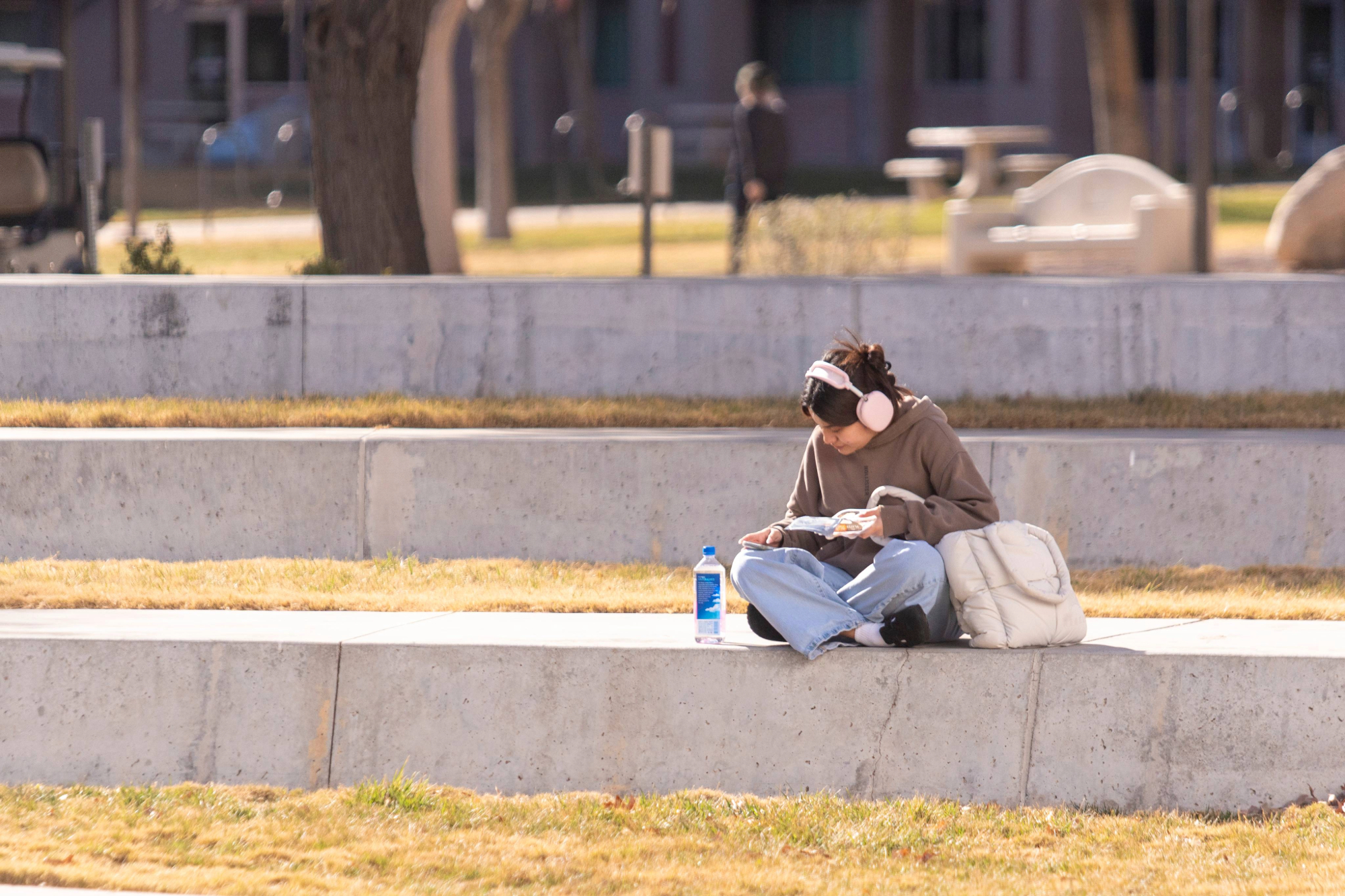 Student sitting in UNLV's academic mall.