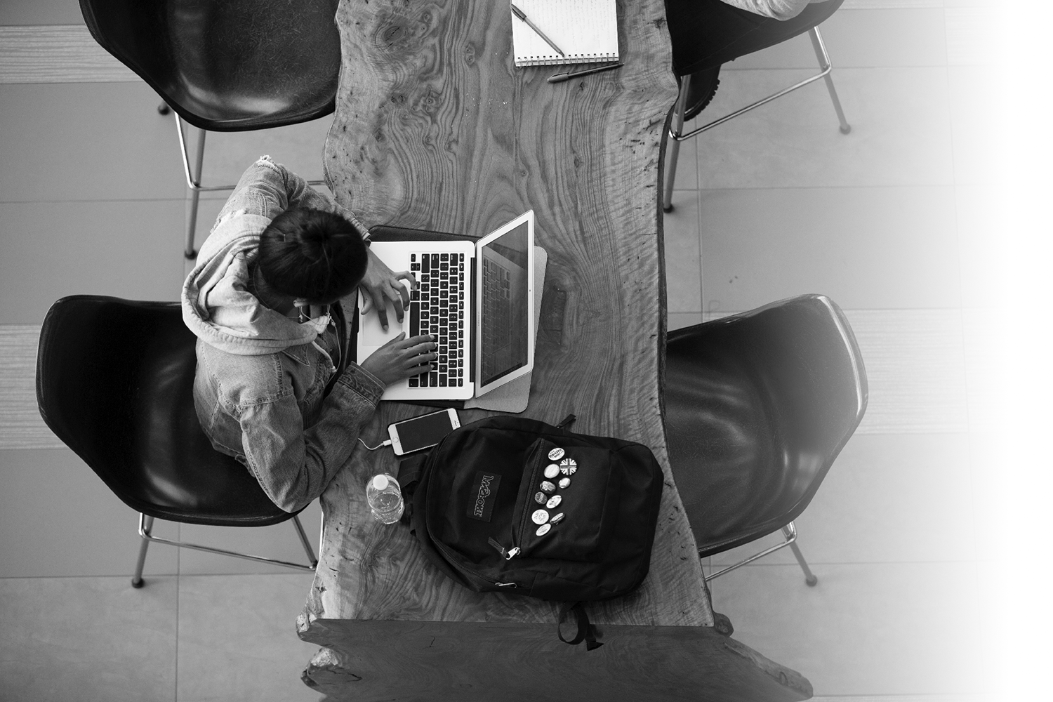 A student studying on a laptop captured from above.