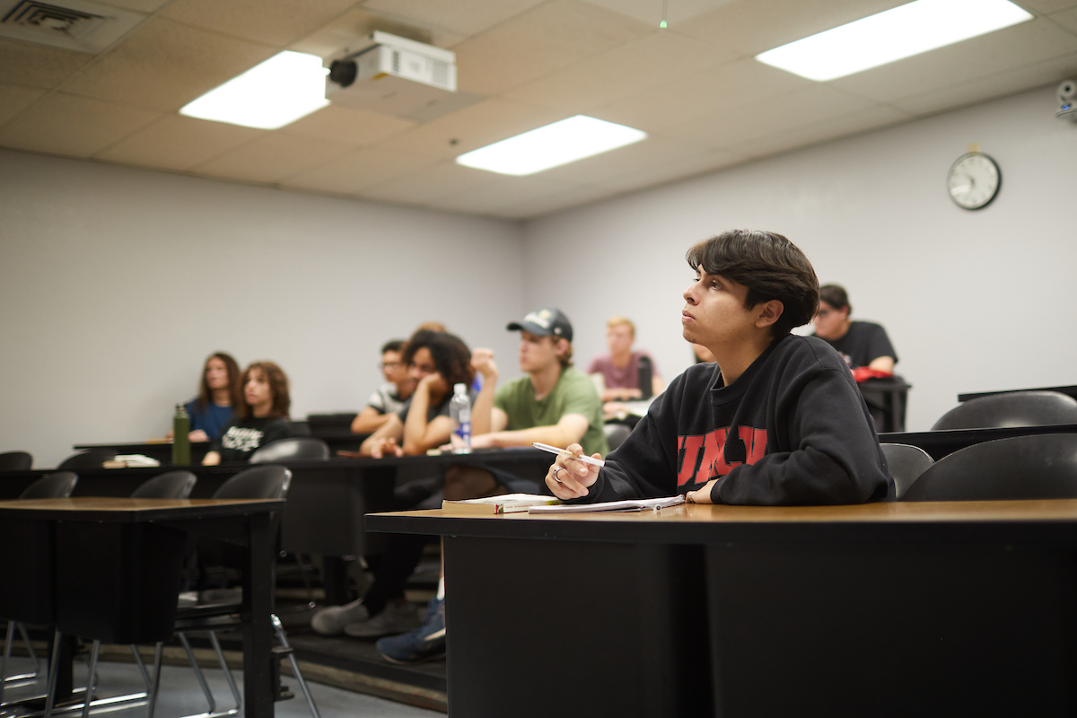 students in class looking towards the front