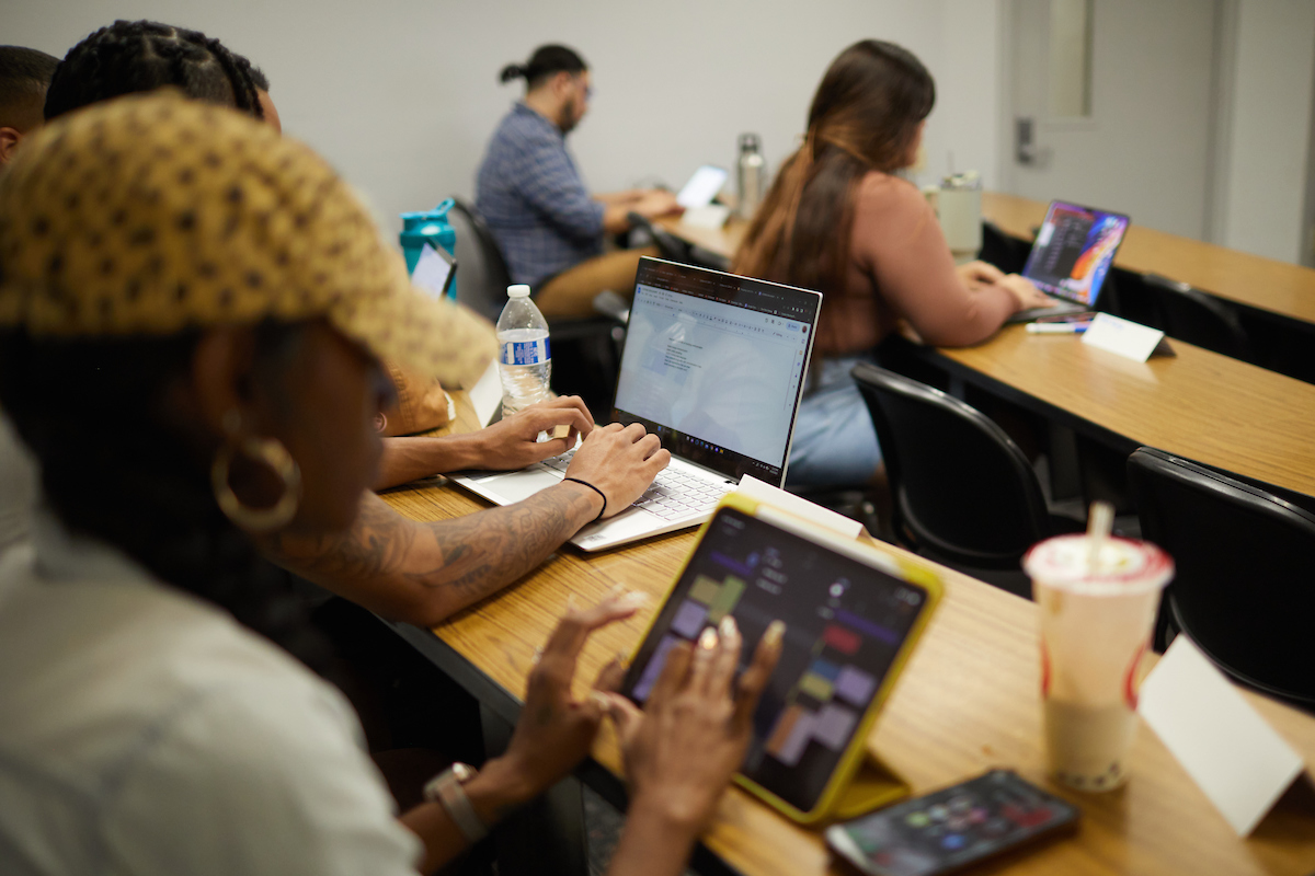 students using devices in class
