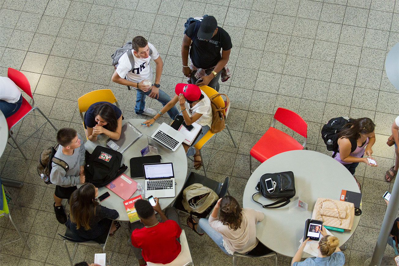 Aerial view of a group of students studying together at the student union.