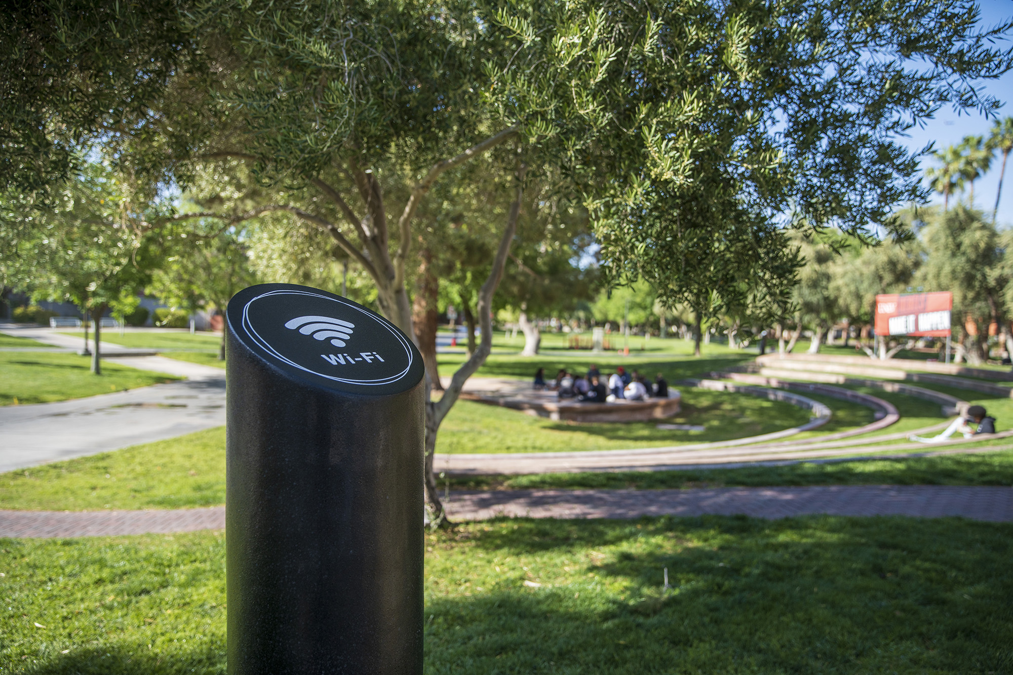 Close shot of a Wi-fi bollard with the UNLV outdoor amphitheater in the background. 
