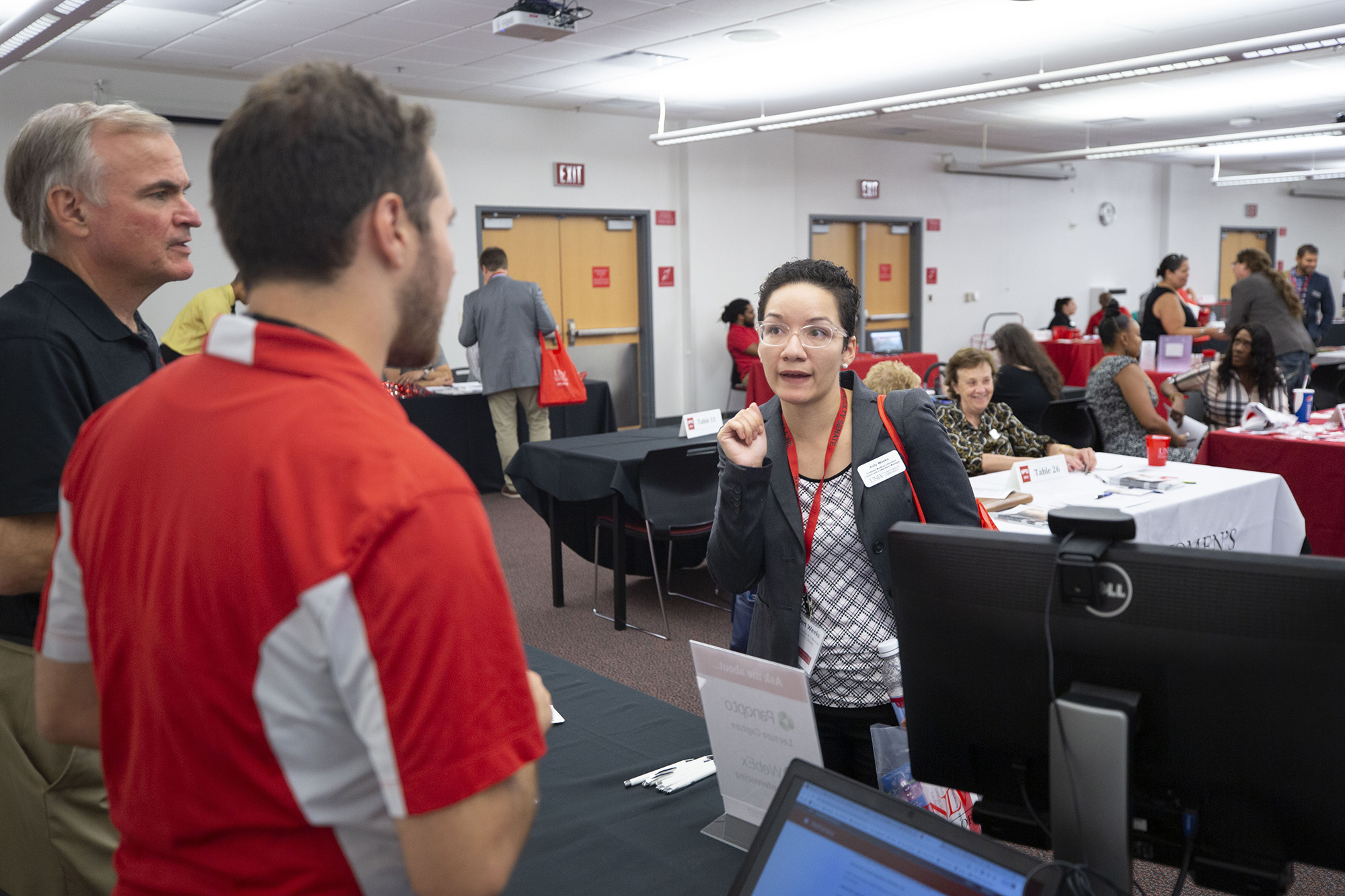 OIT staff members assist a customer during new staff orientation.