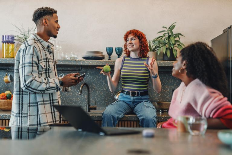 A group of people sitting around a table.