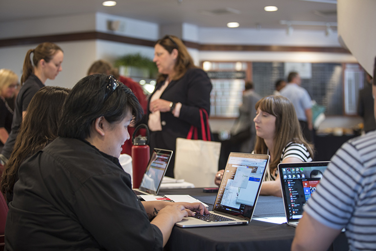 U-N-L-V employees assist new staff at orientation.