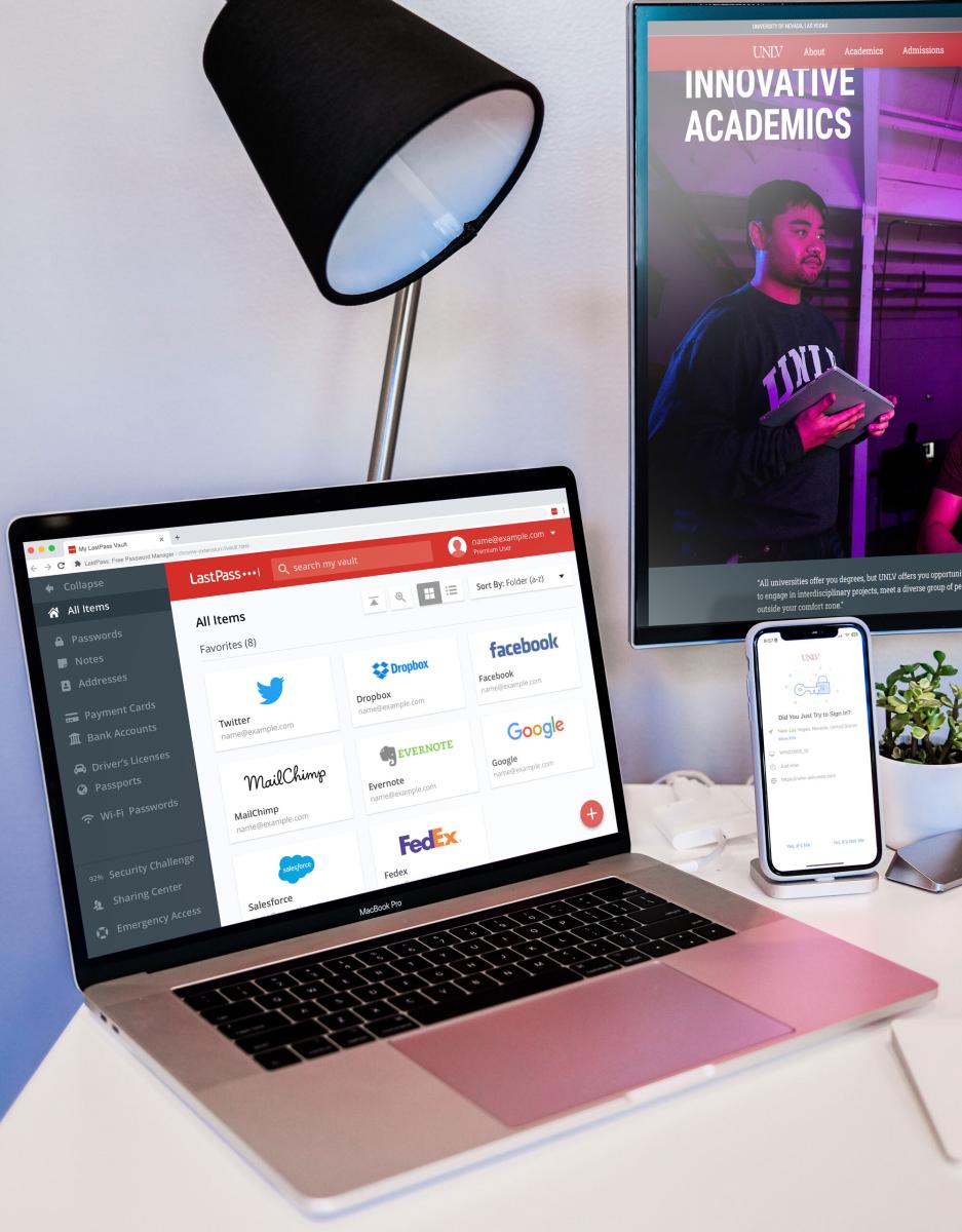 A Macbook and mobile device on a desk with LastPass on the screens.