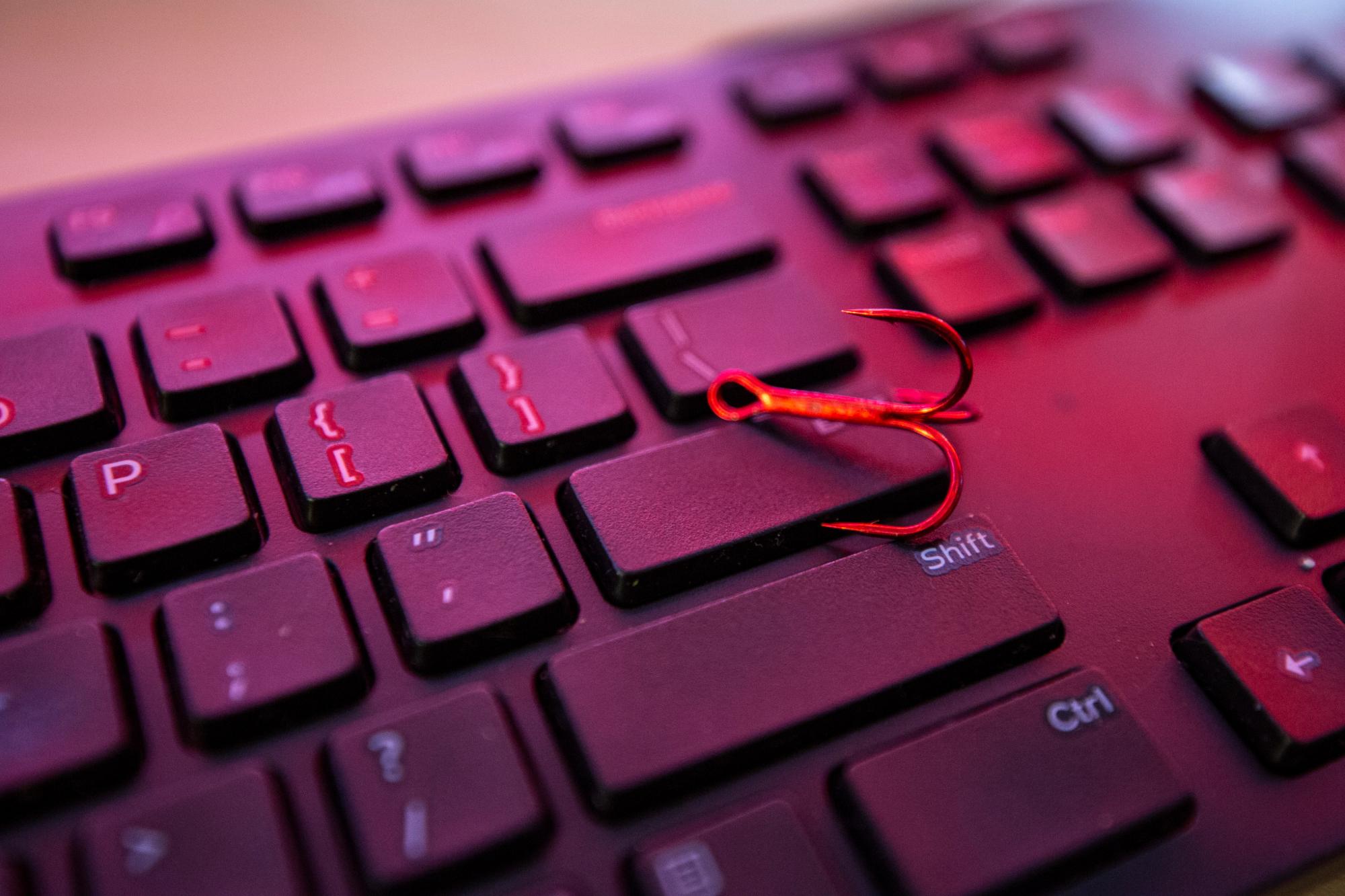 Phishing pin on keyboard.