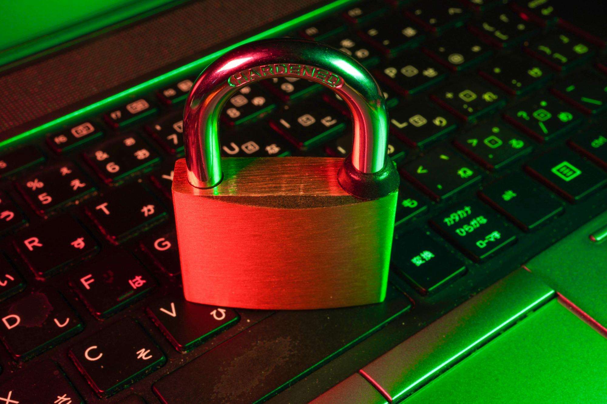 Padlock on top of computer keyboard.