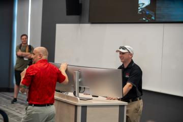 Frank Alaimo and Michael Theil speaking to audience. 