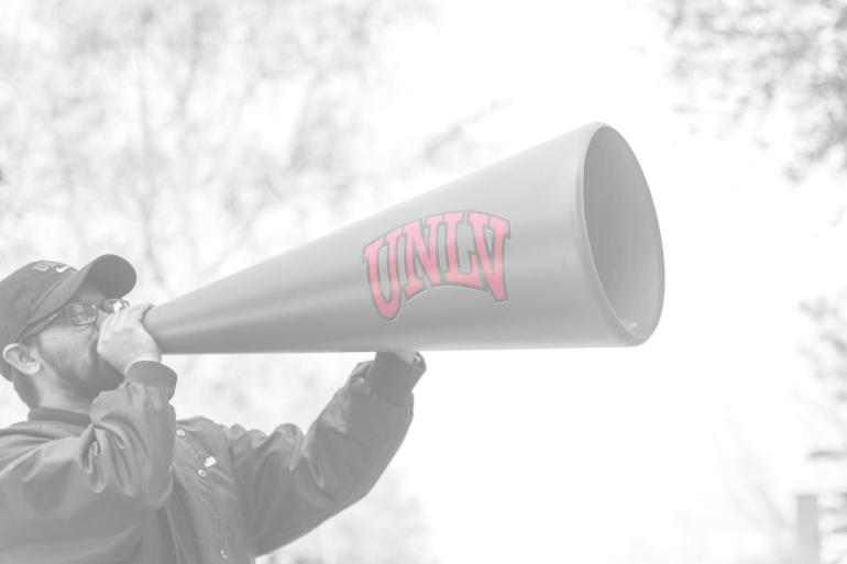 Person holding megaphone with UNLV on it